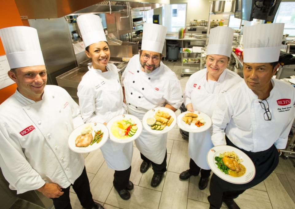 Chefs from Rich Products with plates of food