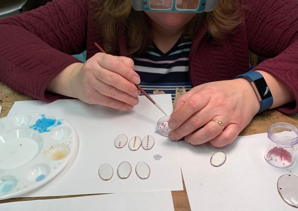 Nahabetian working at an artists bench