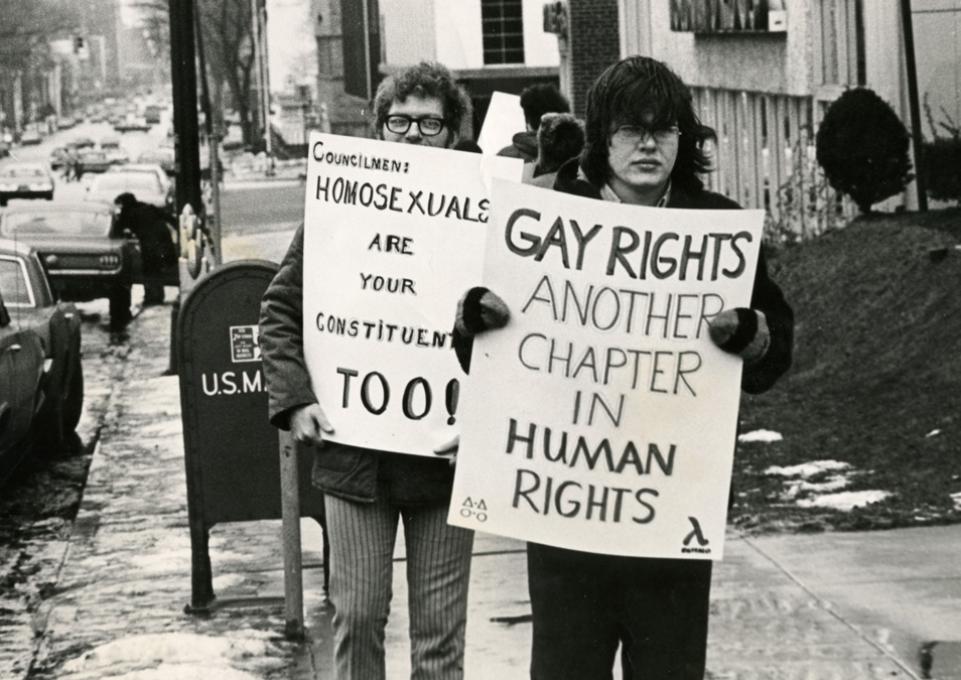 Protesters with signs at first  gay rights protest in Buffalo