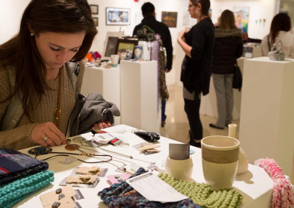 Customer shopping the student art sale