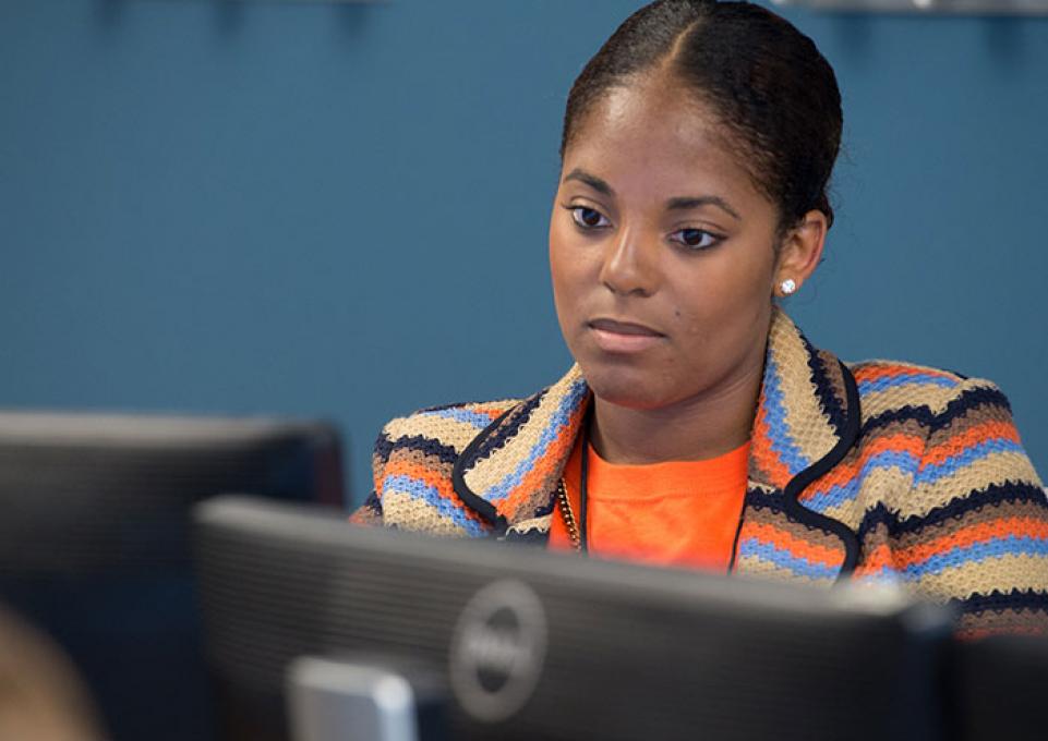 A female doing work on the computer