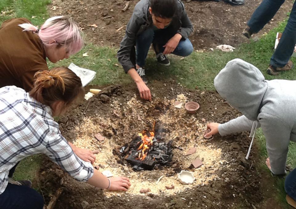 young people making fire