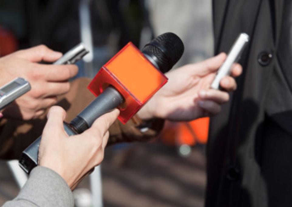 Reporters' microphones