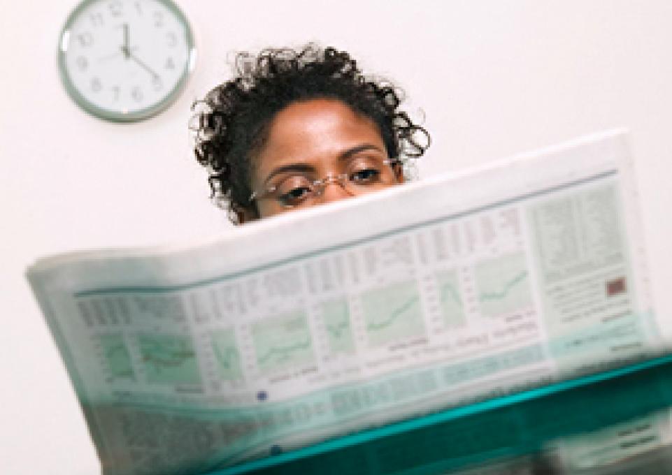 lady reading newspaper