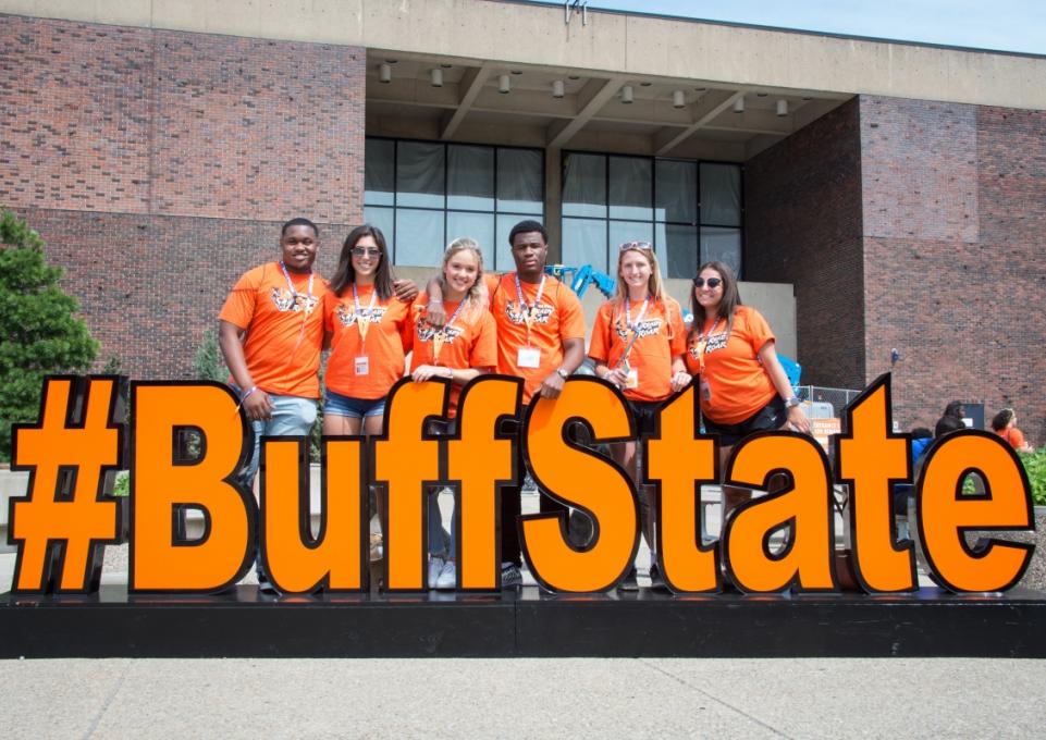 Students standing behind the #BuffState logo